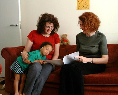 Marian Grimes working with a family